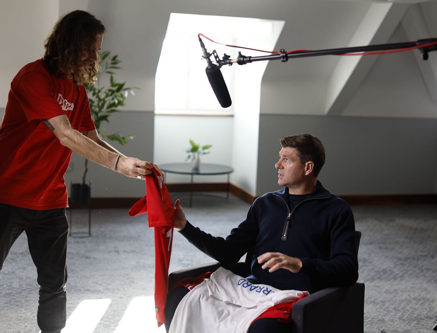 Handing Steven Gerrard the shirt on set