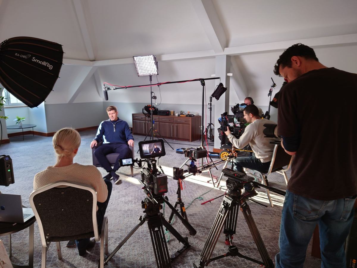 The full interview set with cameras, lights and crew